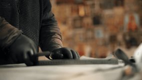 Craftsman cutting leather material in artisan workshop - Powered by Shutterstock - Get 15% off with code: PIKWIZARD15