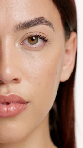 Mascara, makeup and half face of woman in studio for beauty, self care and aesthetic. Microblading, glow and closeup with portrait of person for shine, cosmetology and eyelash growth treatment