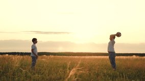 People nature, child kid playing ball lawn outdoors, happy childhood schoolchildren sunset, running, boys playing ball with friends as the sun sets., family and friends play football at golden hour - Powered by Shutterstock - Get 15% off with code: PIKWIZARD15