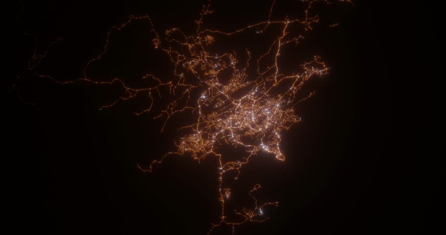 Port Moresby (Papua New Guinea) top view at night. Aerial view on modern city with lights. Camera is flying above the city, moving backward. Vertical video. The north is on the left side