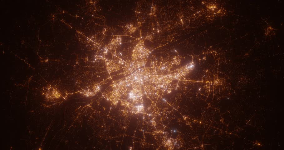 Warsaw (Poland) top view at night. Top view on modern city with street lights and glow effect. Camera is zooming in, rotating clockwise. Vertical video. The north is on the left side