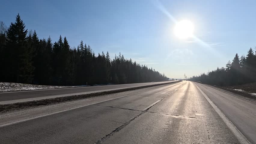 Winter road with snow, highway on a sunny winter day. Winter landscape, road with snow.	