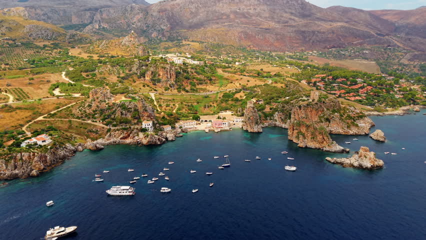 Panorama Of Scopello Coastal Village In Castellammare del Golfo, Trapani Province, Sicily, Southern Italy. Aerial Pullback Shot