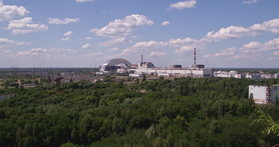 The Arched Structure Of The New Safe Confinement At Chernobyl Nuclear Power Plant In Ukraine. Aerial Zoom In Shot
