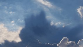Dramatic sunbeams breaking through white cumulus clouds in deep blue sky creating crepuscular rays and divine light - Powered by Shutterstock - Get 15% off with code: PIKWIZARD15