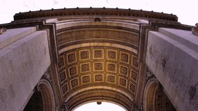 A detailed low-angle time-lapse looking up at the ornate, coffered ceiling under the main arch of the Arc de Triomphe in Paris.  - Powered by Shutterstock - Get 15% off with code: PIKWIZARD15