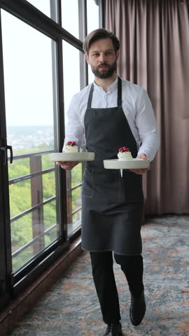 Vertical Video Waiter brings dessert to couple in restaurant. Customer service.