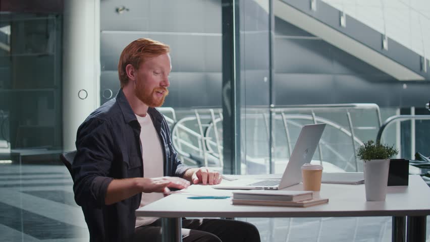 Personal Branding, Self-Driven Work, Communication. A Professional Man in His Office Receives Great News During a Phone Call and Smiles With Joy. A Moment of Career Growth, Digital Identity