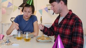 Couple celebrating birthday at home, Couple enjoying cozy wine dinner together at modern white kitchen and dinning room. cozy vibes . Evening full of love, connection, and calm conversation. - Powered by Shutterstock - Get 15% off with code: PIKWIZARD15