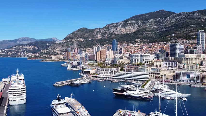 Aerial of Port Hercule, Monaco with mega yachts and skyline