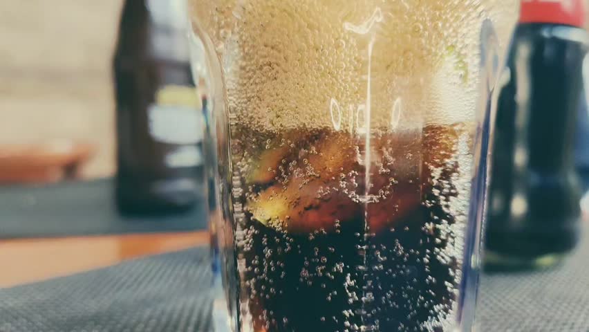 Pouring cocktail in to a glass