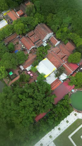 Nam Dinh, October 11, 2025 — Ancient temple in Vietnam surrounded by trees and old walls, preserving cultural memory.