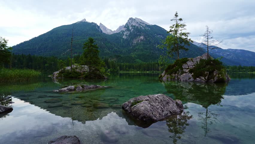 Hintersee Lake and Watzmann Mountain. Ripple and Reflection on Water. Rocks and Trees. Bavaria, Germany