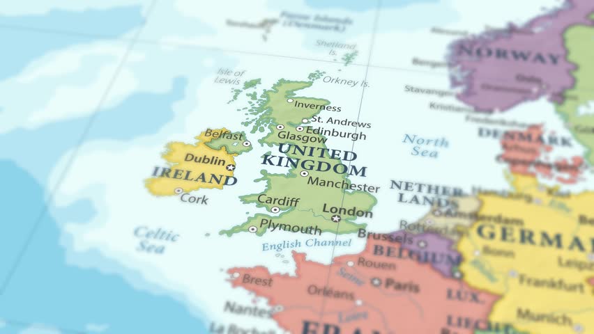 4K macro footage of United Kingdom on a world map with shallow depth of field. Focus on word United Kingdom and nearby regions. Travel geography footage