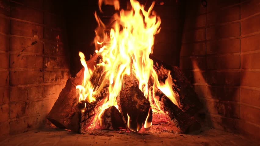 Fire burning in fireplace. Warm home in winter, Christmas holiday celebration