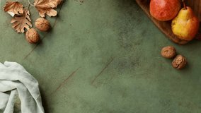 Serving French poached pear tart, made with a sweet frangipane, almond and walnuts cream. Green table with autumn decoration.  Autumn holidays, Thanksgiving dessert. - Powered by Shutterstock - Get 15% off with code: PIKWIZARD15