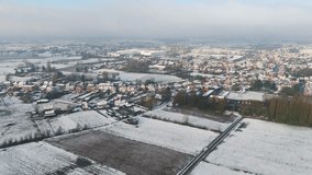 snow covered open fields homes buggenhout belgium offering horizon cloudy sky beautiful winter landscape towards long aerial view snow-covered - Powered by Shutterstock - Get 15% off with code: PIKWIZARD15