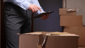 Delivery man managing logistics using digital tablet - Powered by Shutterstock - Get 15% off with code: PIKWIZARD15