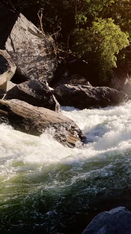 River Rapids in the Merced River as it runs through Yosemite National Park in California. This video Loops seamlessly. Vertical Video.