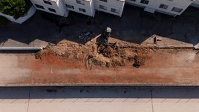 Aerial view of excavator removing soil and debris during road construction in October 2025 - Powered by Shutterstock - Get 15% off with code: PIKWIZARD15