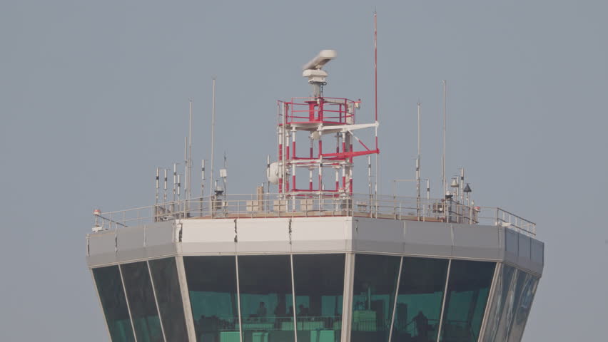 close up of the air traffic control tower in an airport 