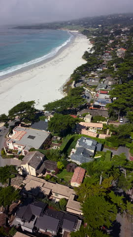Stunning aerial shots of the picturesque Carmel by the Sea, expertly showcasing the beautiful coastline, charming coastal homes, and serene, inviting beaches that enchant visitors and residents alike