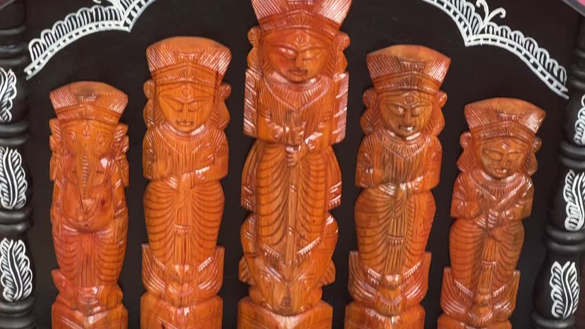 Durga Maa idol made with wood in a tribal art form in Kolkata