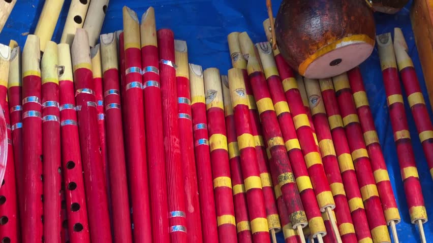 Different types of wooden instruments like Bansuri, ektara made by handicraft artist sold in Shantiniketan, West Bengal. 