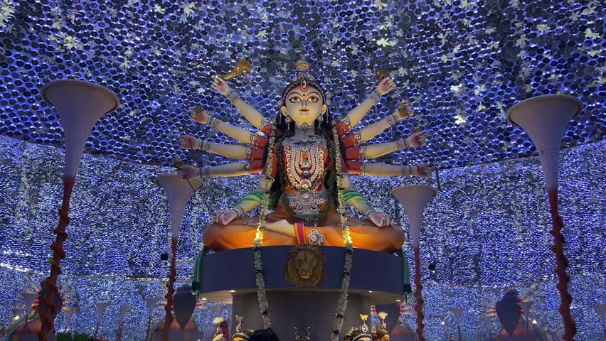 Beautiful Durga idol decorated with blue colored lights and mirror in the year 2025