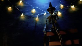 Magic books.Books set, Garland with stars and decorative skeleton with gradient light.Halloween books. Place for Text. 4k footage - Powered by Shutterstock - Get 15% off with code: PIKWIZARD15