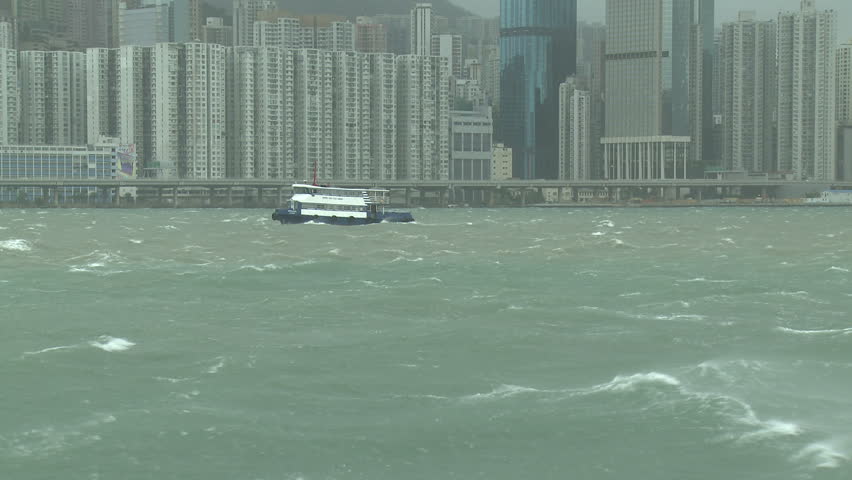 Boat sails in stormy seas in Hong Kong harbour - Full HD 1920x1080 30p shot on