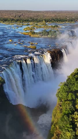 Victoria Falls At Livingstone In Northern Rhodesia Zambia. Giant Waterfalls. Nature Landscape. Livingstone At Northern Rhodesia Zambia. Zambezi River. Travel Scenery.