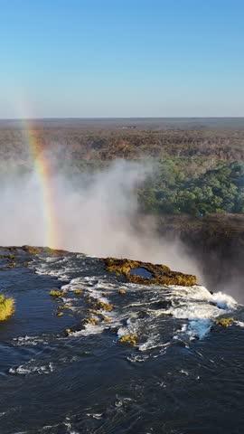 Wild Water Fall At Victoria Falls In Matabeleland North Zimbabwe. Nature Waterfall. Zambezi River Landscape. Victoria Falls At Matabeleland North Zimbabwe. Southern Africa. Tourism Travel.