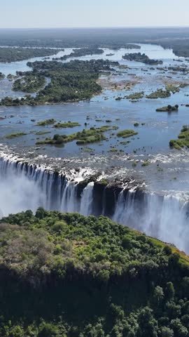Famous Water Falls At Victoria Falls In Matabeleland North Zimbabwe. Nature Waterfall. Zambezi River Landscape. Victoria Falls At Matabeleland North Zimbabwe. Southern Africa. Tourism Travel.