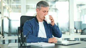 Content mature businessman in smart casual attire drinks coffee before typing on laptop. Focused professional works efficiently at modern office desk, demonstrating productivity and quiet satisfaction - Powered by Shutterstock - Get 15% off with code: PIKWIZARD15