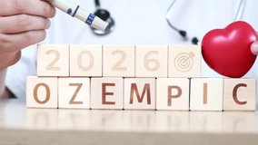 Health professional discusses the importance of Ozempic in diabetes treatment while interacting with wooden blocks and a heart symbol, highlighting future expectations for 2026 - Powered by Shutterstock - Get 15% off with code: PIKWIZARD15