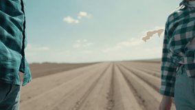 Close-up of a handshake between a male and female farmer in a field. Symbol of partnership, trust, and teamwork in agriculture. Rural cooperation and mutual respect in farming life. - Powered by Shutterstock - Get 15% off with code: PIKWIZARD15