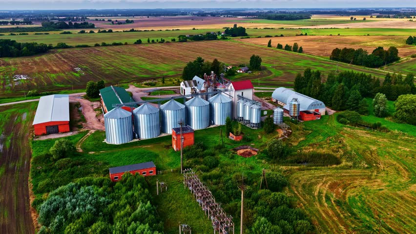 Grain silo agriculture crop harvest industrial storage facility, aerial above farm