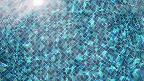 Swimming pool with wavy turquoise water background Caustic water background. Seamlessly looping 3D animation. 4K - Powered by Shutterstock - Get 15% off with code: PIKWIZARD15