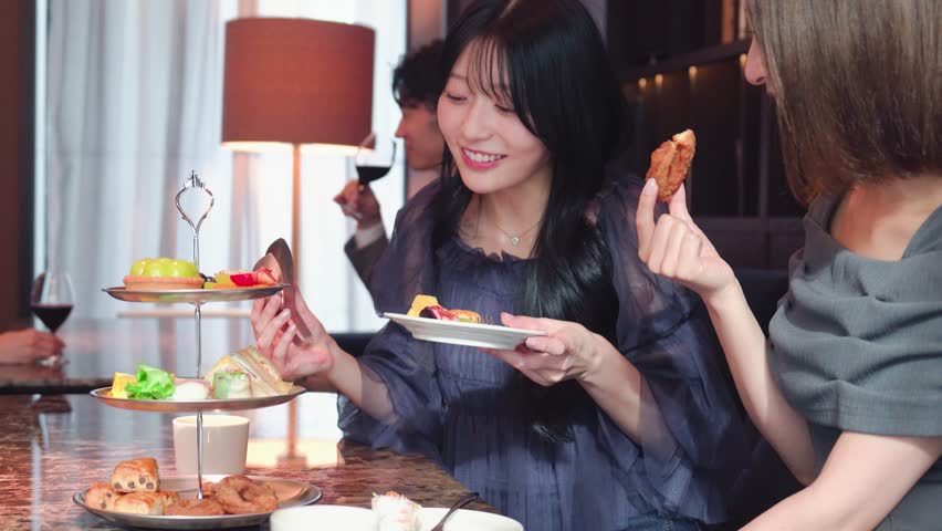 People spending time in a hotel lounge café during the afternoon
