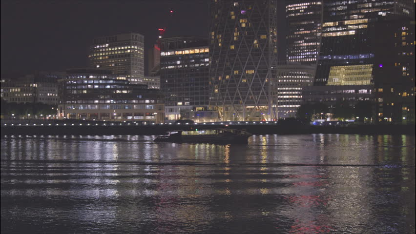 Uber Boat on River Thames at Night, View of Canary Wharf London from Rotherhithe