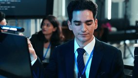 Software developer discussing work with colleague in the office. Tech team brainstorming project and reviewing data. Programming code, Web development. Innovative collaboration - Powered by Shutterstock - Get 15% off with code: PIKWIZARD15