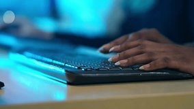 A close-up of a woman's hands typing on a keyboard with blue ambient light. Digital work, coding, data entry, or customer service. Concepts of technology, cybersecurity, and night shifts in office - Powered by Shutterstock - Get 15% off with code: PIKWIZARD15
