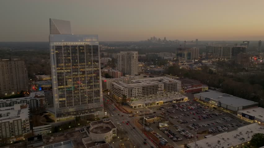 Buckhead uptown commercial glass building in evening, large parking lot, Piedmont road, , Georgia, Aerial