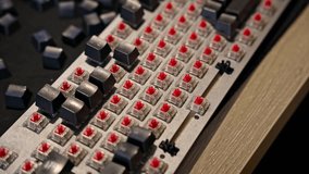 Close up view of man repairing mechanical keyboard, installing keycaps on red switches. Selective focus on hands and keys, concept of electronics, DIY, and computer maintenance - Powered by Shutterstock - Get 15% off with code: PIKWIZARD15