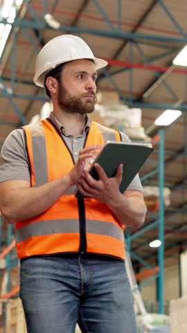Tablet, man walk and warehouse worker thinking of inventory inspection, shipping or logistics. Tech, distribution and person planning storage for stock, supply chain and quality control in low angle