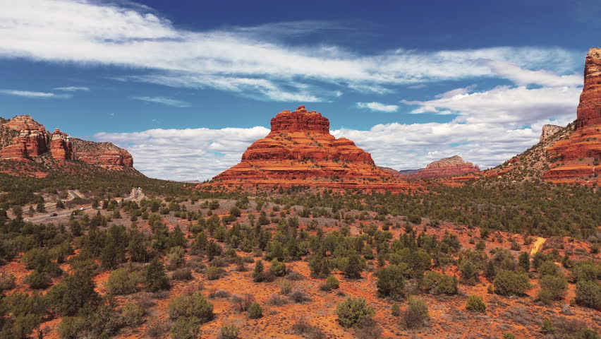 Approaching Bell Rock and Cathedral Rock in Sedona, Arizona, United States. Aerial Drone Shot