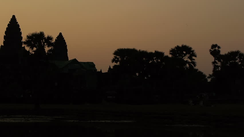 Pan of Angkor Wat at sunrise
