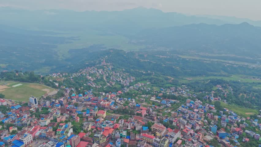 Beautiful hillside view of Tansen Palpa, Nepal, showcasing green mountains, traditional houses, and the peaceful charm of this historic hill town surrounded by nature.