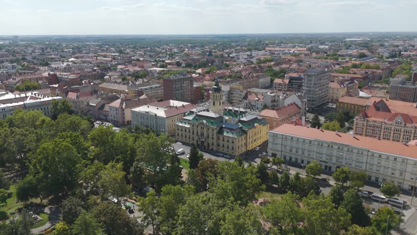 Aerial view of Szeged City Hall with the cityscape in the background, highlighting its historic architecture and urban surroundings.